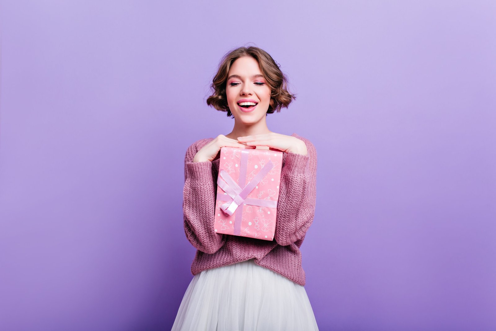 Happy woman with colorful boxes